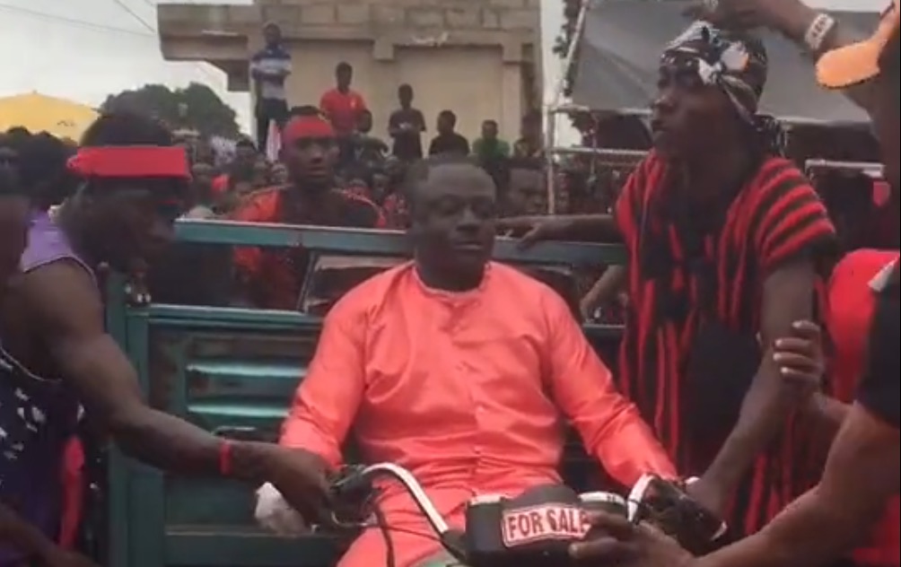 BIZARRE: Dead Man Riding Bike in Africa - Watch Video