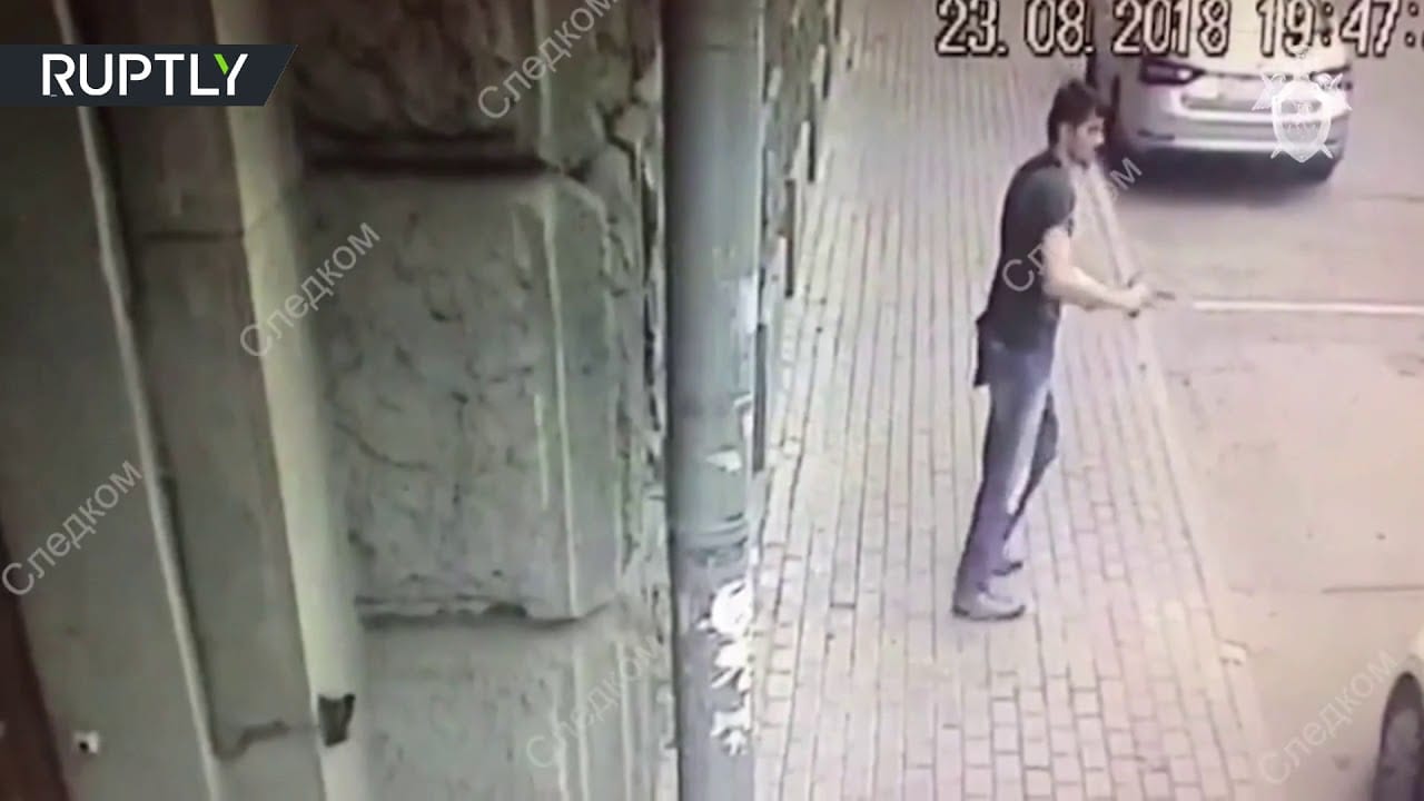 Crazy Man Attacks 2 Russian Caps In The Streets With A