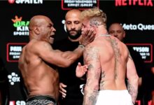 Mike Tyson slaps Jake Paul at their weigh-in Thursday, Nov. 14, 2024 at Irving's Toyota Music Factory on the night before their fight at Arlington's AT&T Stadium. Stephen McCarthy/Sportsfile via Getty Images