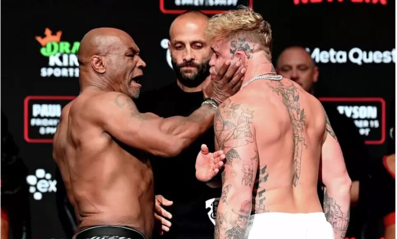 Mike Tyson slaps Jake Paul at their weigh-in Thursday, Nov. 14, 2024 at Irving's Toyota Music Factory on the night before their fight at Arlington's AT&T Stadium. Stephen McCarthy/Sportsfile via Getty Images